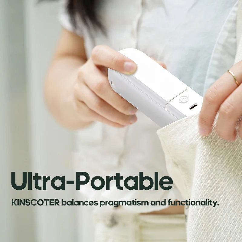 Ultra-portable Kinscoter mini fan fitting easily into a handbag pocket
