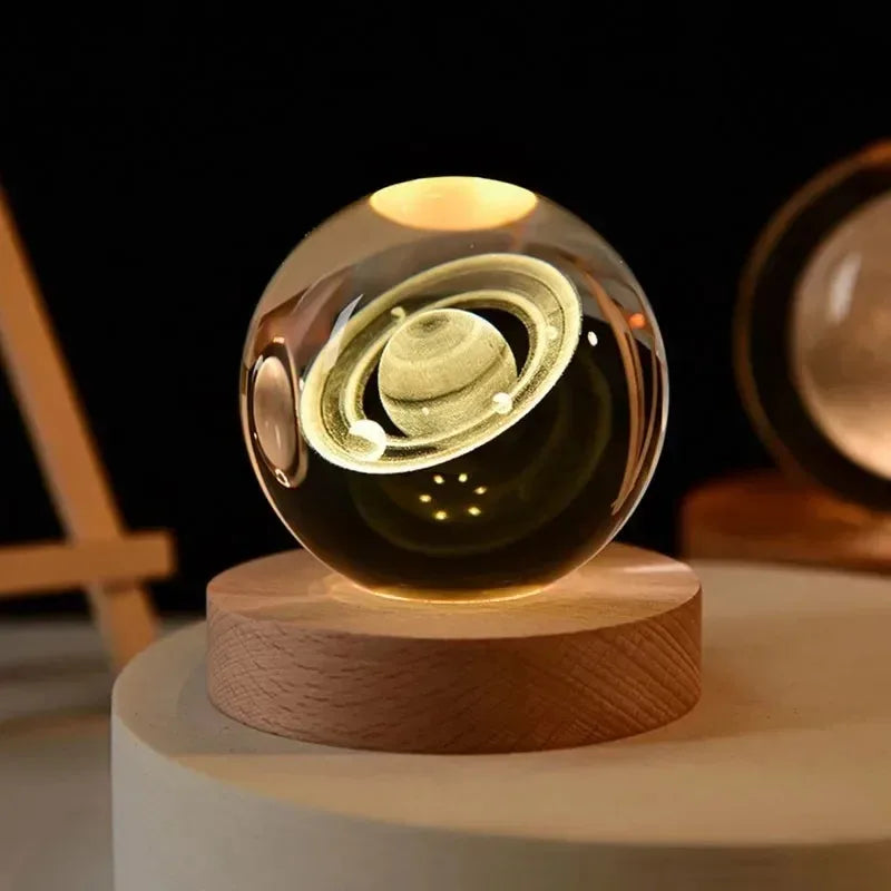 Glass ball with wooden base on a dark background
